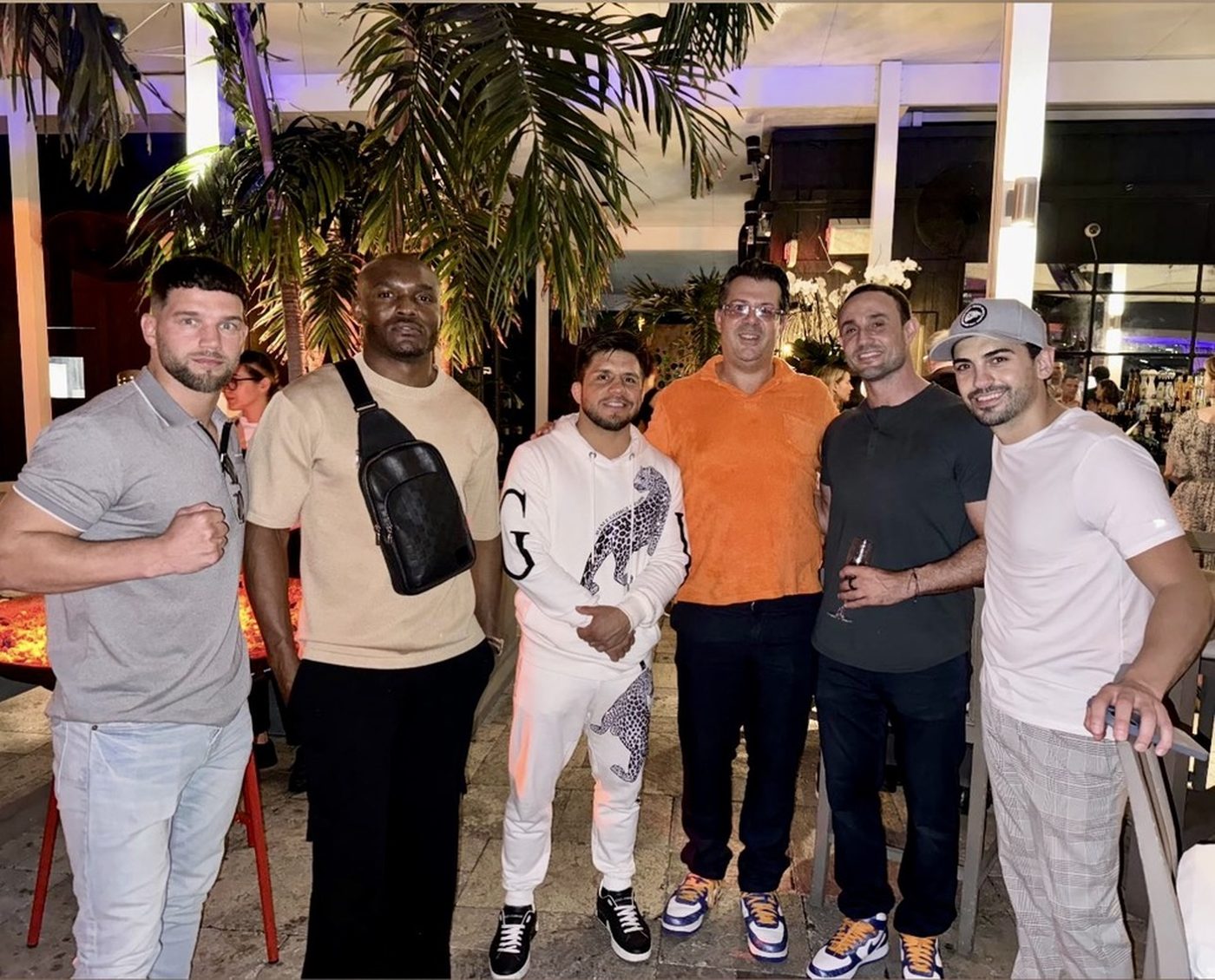 Henry Cejudo, Kamaru Usman and guests at Typhon's monthly networking event at The Deck at Island Gardens